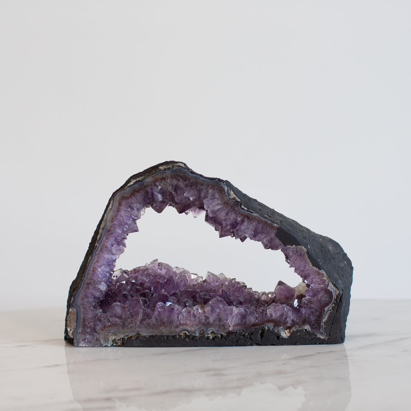 Enter the Mystical Realm of Amethyst with an Open Cave Formation